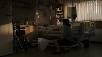 The central protagonist takes care of her comatose husband