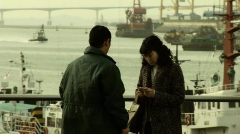 Jung-rim must visit the docks to escape her country Jung-rim must visit the docks to escape her country