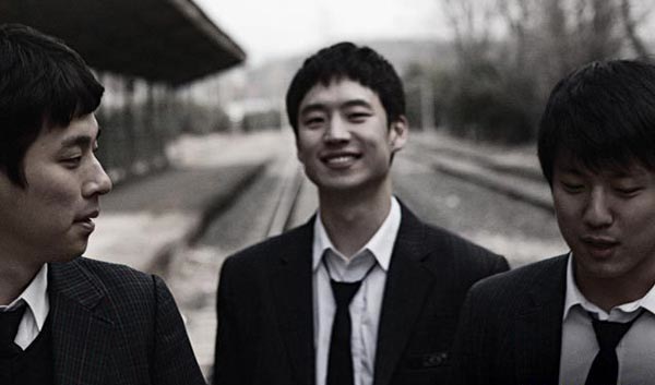 Hee-joon, Gi-tae, and Dong-yoon hang out at the abandoned rail track