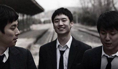 Hee-joon, Gi-tae, and Dong-yoon hang out at the abandoned rail track