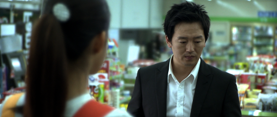 The man attempts to forge a relationship with a convenience store worker