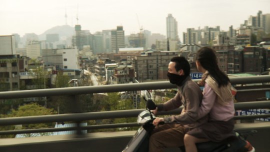 Joon and Soon-hee traverse the unwelcoming Seoul landscape