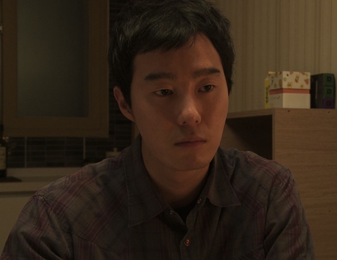 The central protagonist attempts to accept his mother's death