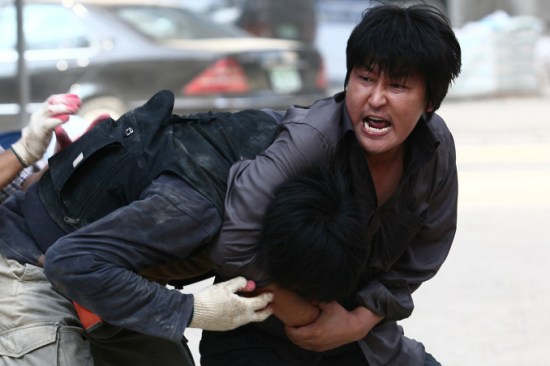 In-gu is violent when necessary but first and foremost is a family man