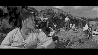 The wives anxiously wait for the return of the fishermen