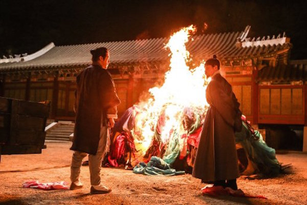 In the conflict between traditional and progressive, how is history created?