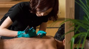 Soo-na notices something strange about a client's tattoo